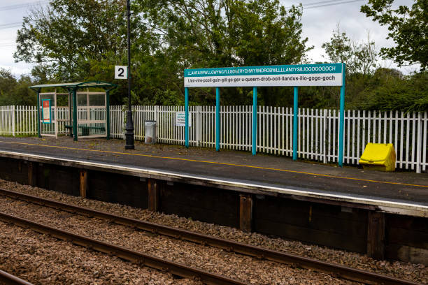 Wales, UK - September 2nd 2020: Place name on the station platform of the town in Wales with the longest name in Europe.  The name is often shortened as Llanfair PG or Llanfairpwll.