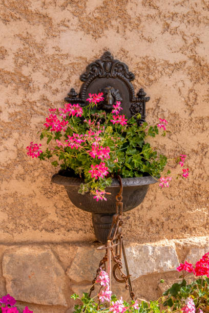 istock Flowers in an iron fountain 1273340688