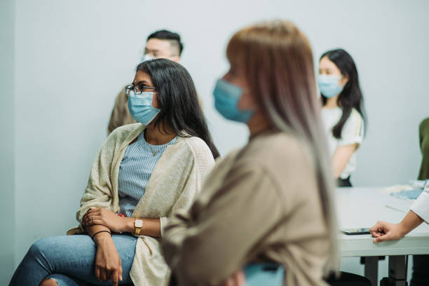 istock Asian female student listening presentation in college classroom 1273342861