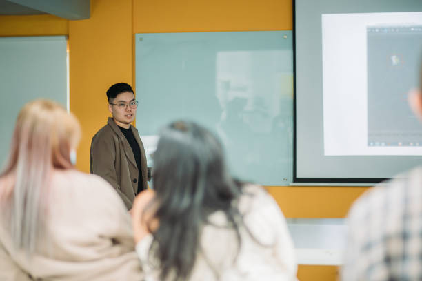 istock Asian chinese female student presenting in college classroom 1273343541