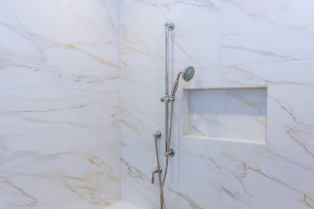 istock New shower head in the bathroom, close-up wall 1273344802