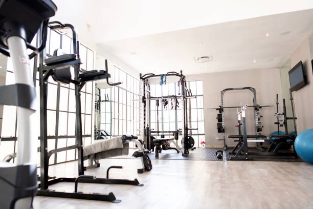 istock Weight lifting exercise machines in luxury hotel gym 1273345324