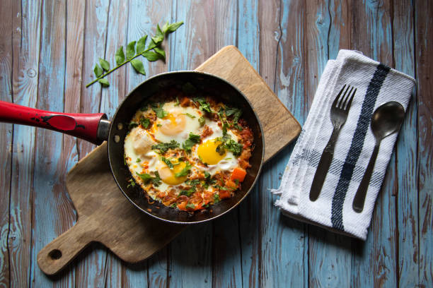 istock Popular dish Shakshouka in a black pan 1273346525