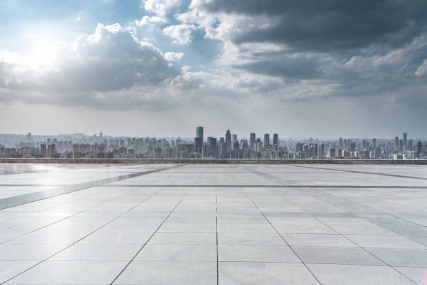 istock empty concrete ground floor with modern cityscape. 1273347711