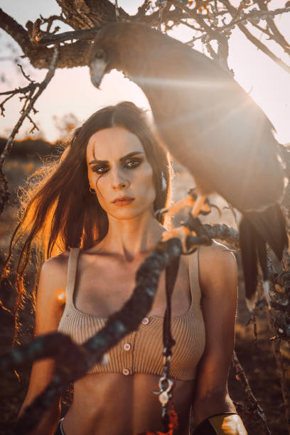 istock Beautiful woman posing on nature with eagle 1273349509