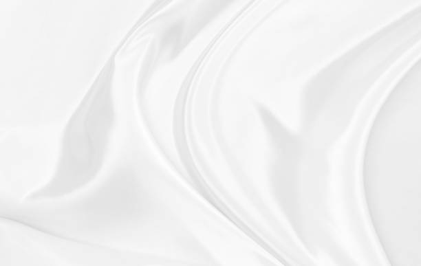 istock White gray satin texture that is white silver fabric silk background with beautiful soft blur pattern natural. 1273350656