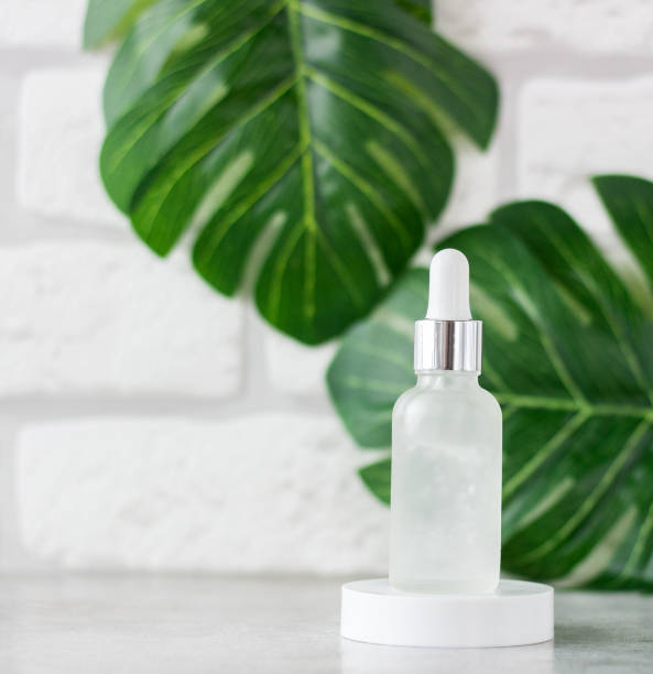 istock Various cosmetics on the background of tropical leaves 1273351886