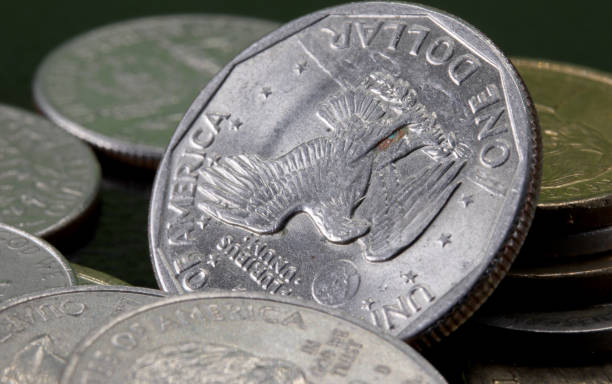 istock close-up one dollar coin detail on background 1273351920