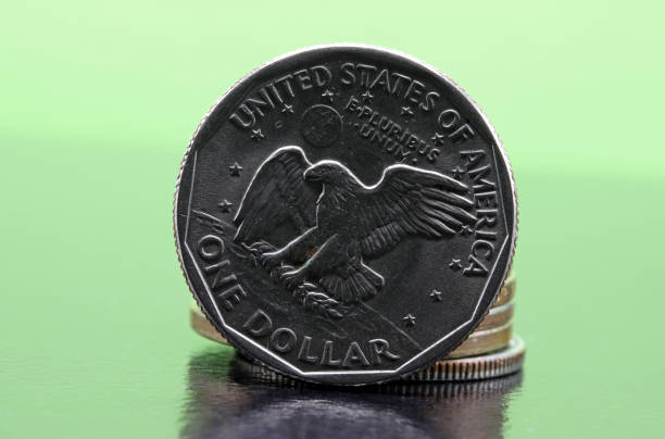 istock close-up one dollar coin detail on background 1273352201