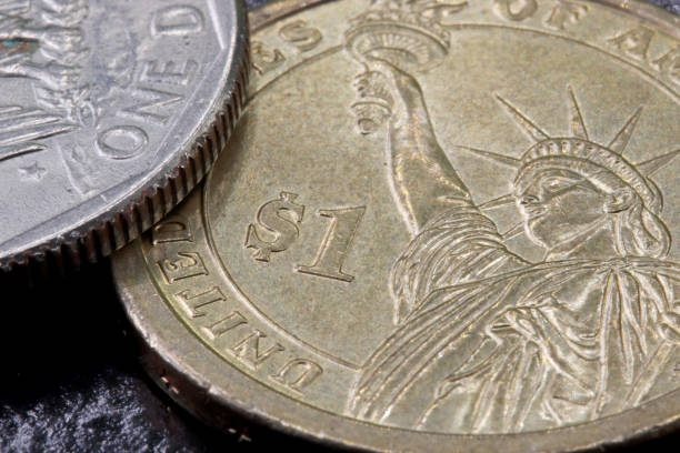 istock close-up one dollar coin detail on background 1273353580