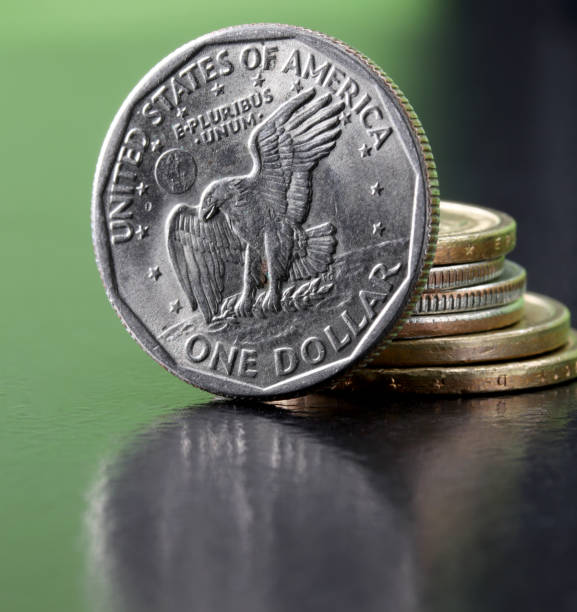 istock close-up one dollar coin detail on background 1273353817