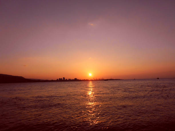 istock sunset over the harbor in Taiwan 1273355301