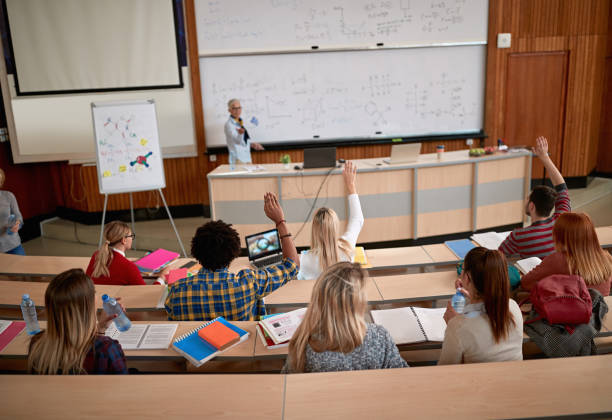 istock Female professor questioning students at a lecture 1273357403