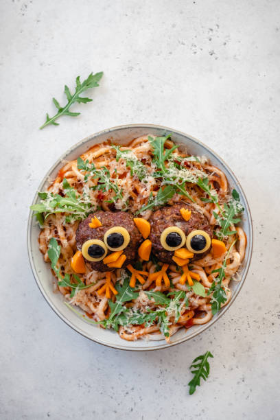 istock Pasta spaghetti with funny birds meatballs for kids 1273359073