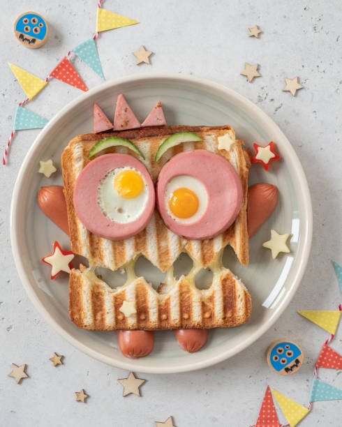 istock Monster sandwich with sausage, eggs and cheese on plate. 1273359927