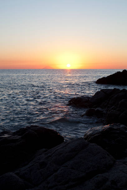 istock Sunset on the rocky shore. 1273360127