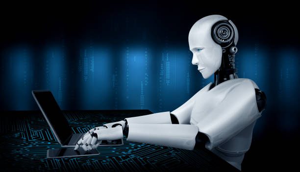 istock Robot humanoid use laptop and sit at table in future office 1273360143