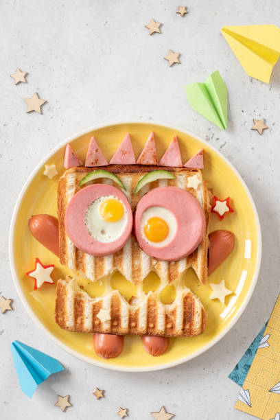 istock Monster sandwich with sausage, eggs and cheese on plate. 1273360546