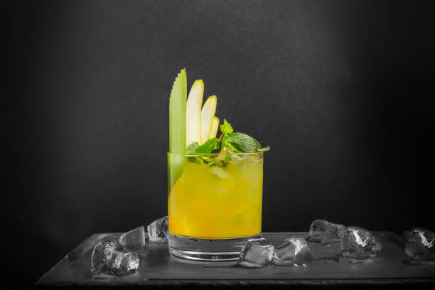 istock Pear lemonade with mint leaves and ice are on a dark background. Copy space. 1273361692