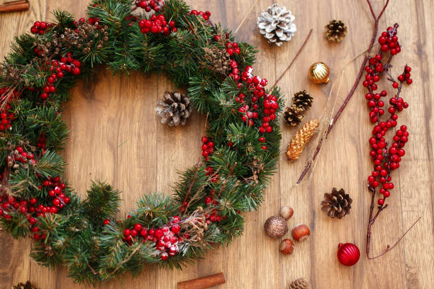 istock Christmas wreath on wooden rustic background flat lay. 1273361781