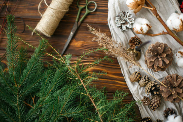 istock Christmas tree branches and decorations for making rustic christmas wreath, holiday workshop 1273362402