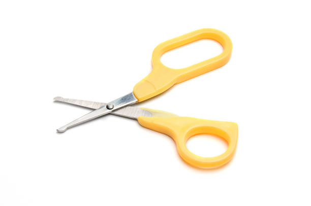 istock Yellow baby scissors on a white background 1273362453