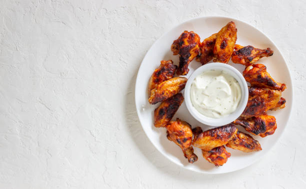 istock Barbecue chicken wings on a white background. Grill. Recipe. 1273363736
