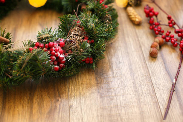istock Christmas wreath on wooden rustic background in house. 1273364137