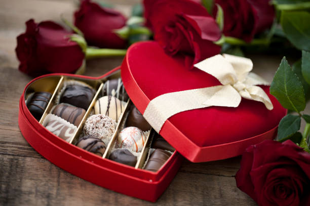 istock Valentine's Day Box of Chocolates and Red Roses 1273364238