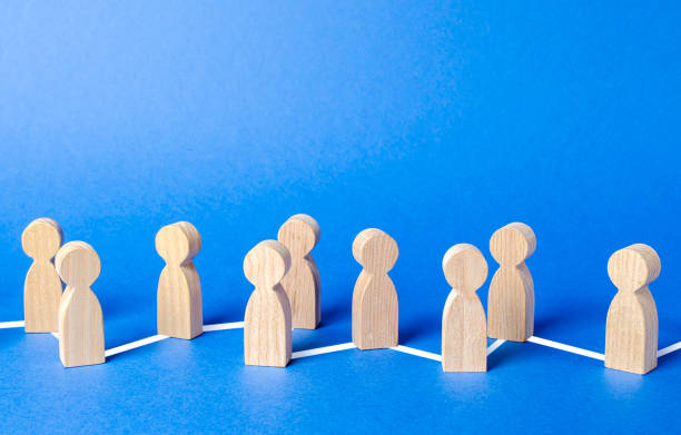 istock Chain of people figurines connected by lines. Cooperation and interaction between people and employees. Dissemination of information in society, rumors. Communication and social networks. 1273364923