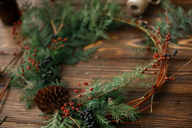 istock Rustic christmas wreath on wooden table, holiday advent. 1273365044