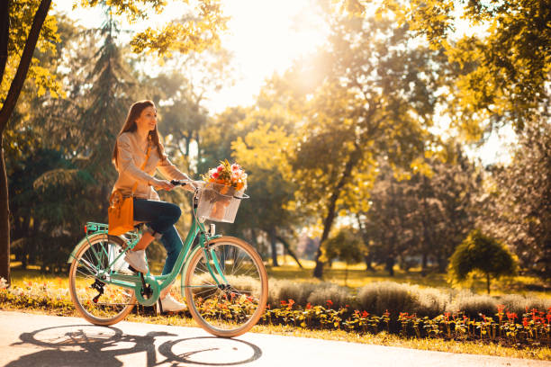 beautiful lady with her beautiful bicycle - ações de bolsa imagens e fotografias de stock