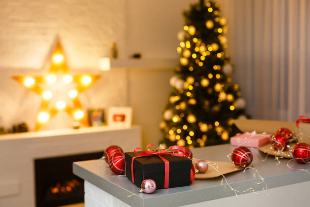 istock Christmas gift box. Christmas presents in boxes at white wooden table. 1273370486