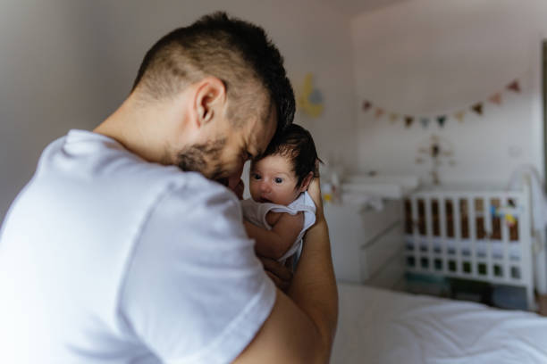 istock Father and a baby in a nursery 1273371424