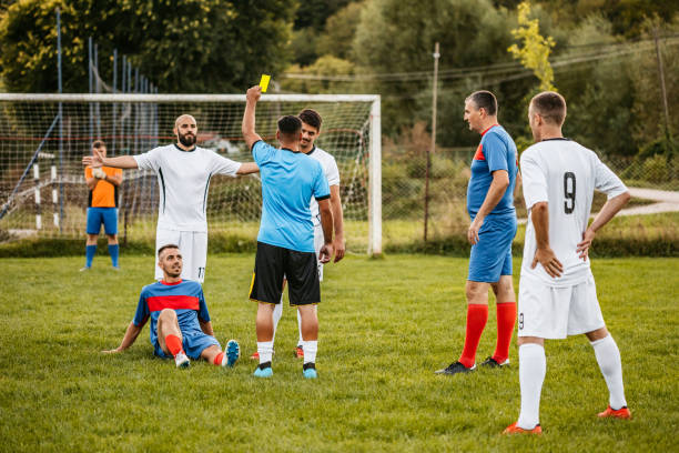 istock Soccer referee showing yellow card 1273371554