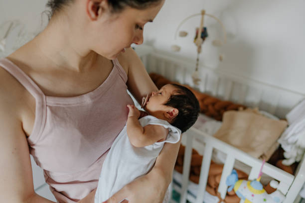 istock Mother and a baby in a nursery 1273371995