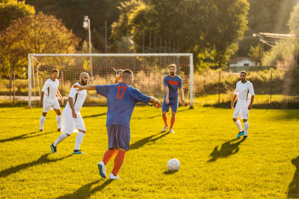 istock Soccer players playing football 1273372073