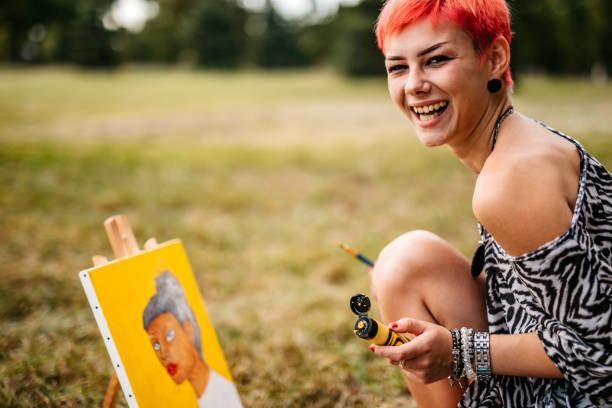 istock Woman painting on meadow 1273373825