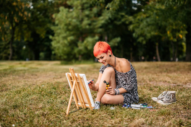 istock Woman painting on meadow 1273374067
