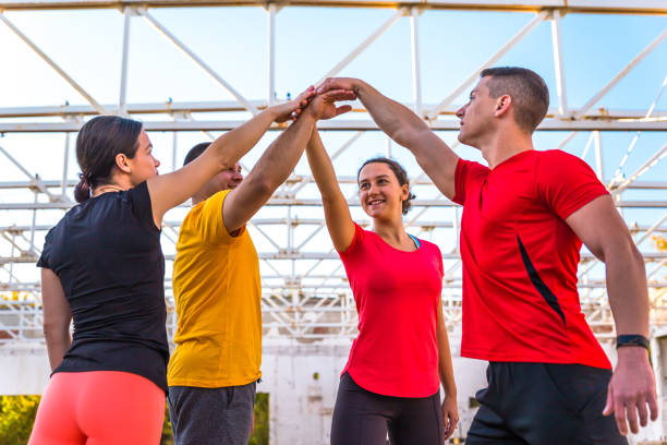 istock Sports people giving five each other 1273374450
