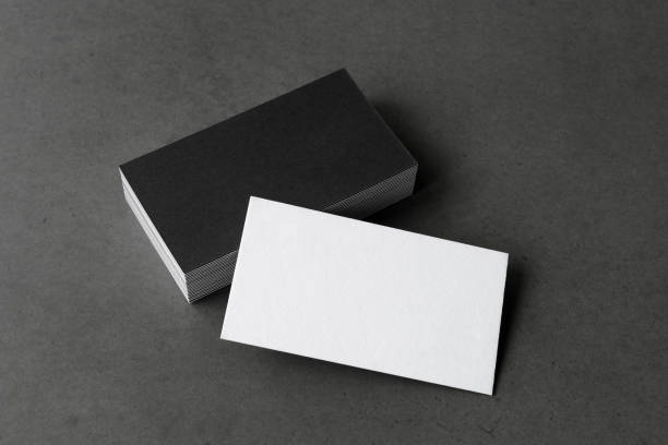 istock Business card on black background. 1273375574