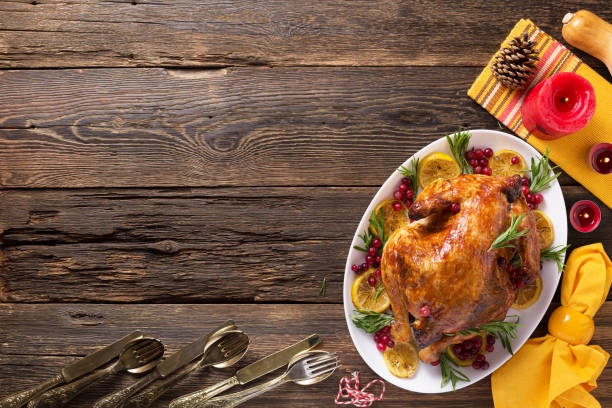istock Thanksgiving chicken on wooden table gala dinner, top view 1273378355