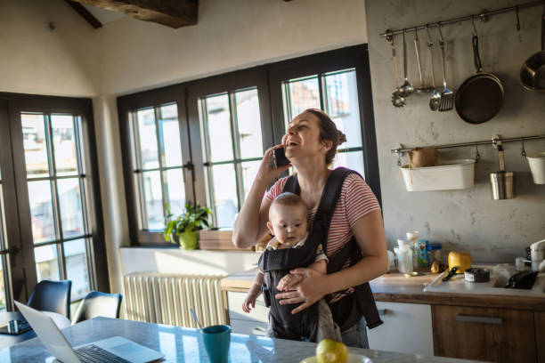 istock Mother with baby at home 1273378685