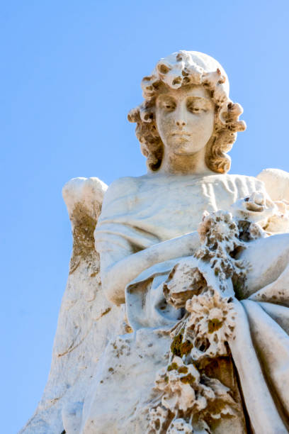 istock Angel, old statue of angle, light blue background with copy space 1273380783