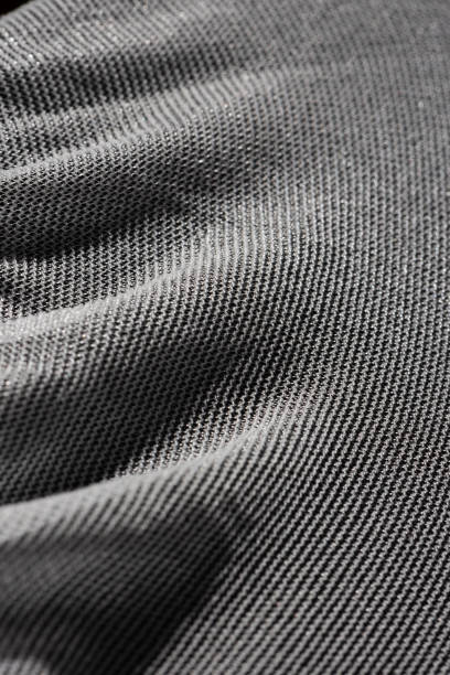 istock Texture of a fine white mesh on black background 1273382496
