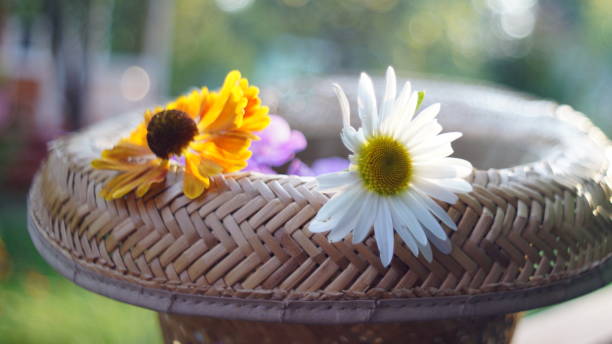 istock Straw hat with flowers in summer garden 1273383515