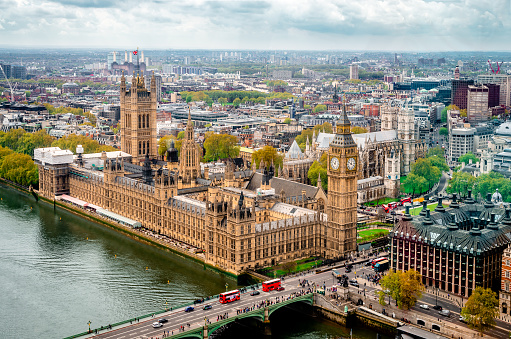 London / UK - April 22 2014: The London skyline (dominated by the Houses of Parliament and the Westminster Abbey) seen from above.