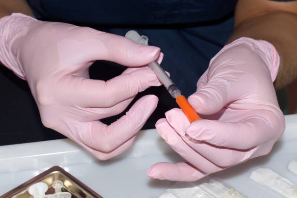 istock syringe for injection in hands of beautician 1273384001