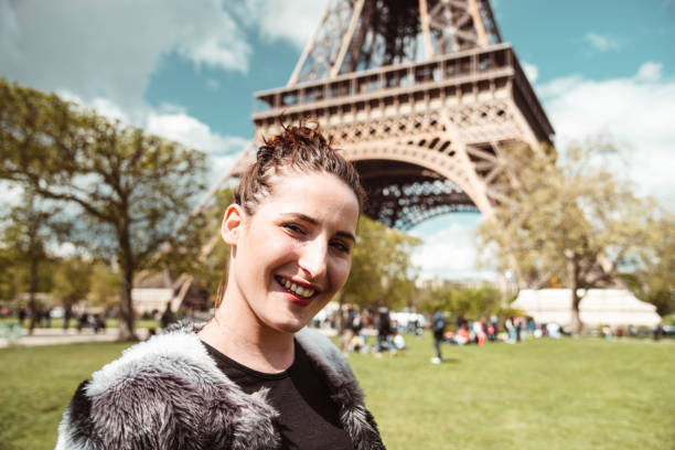 istock beautiful woman portrait under the tour eiffel 1273386164