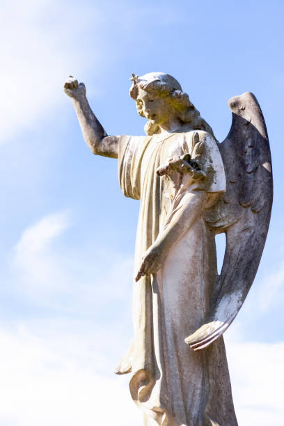 istock Angel, old statue of angle, sky background with copy space 1273386868